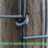 Close Up Galvanised Staples on Wooden Post