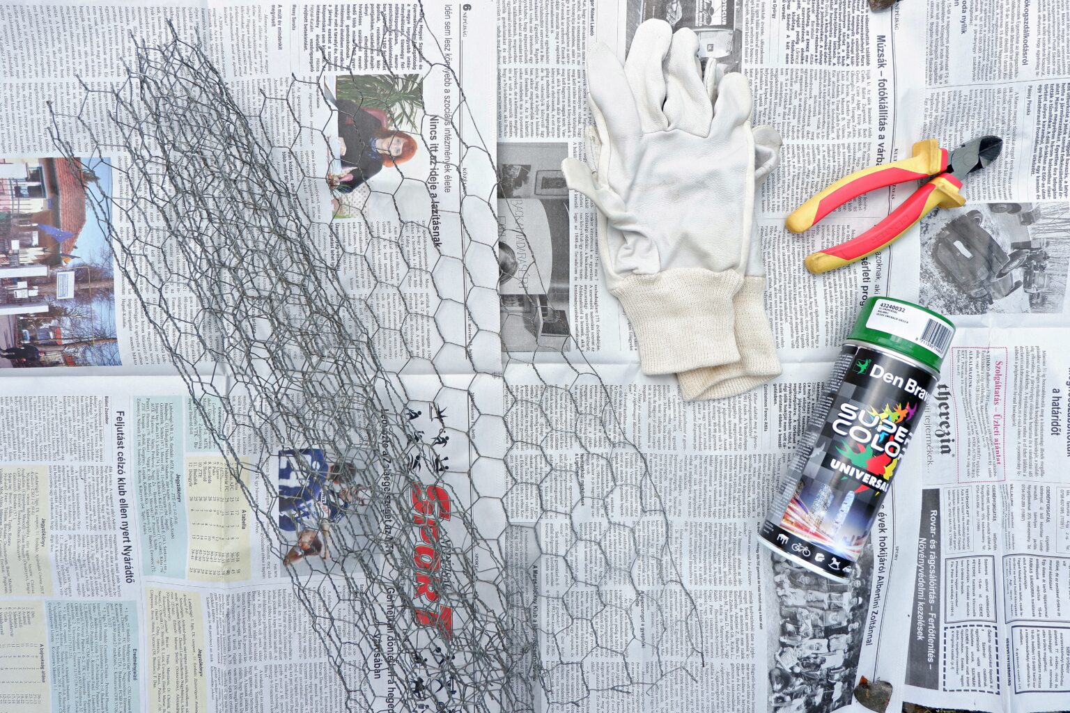 newspapers-with-chicken-wire-and-protective-gloves-wire-cutters-and-spray-paint