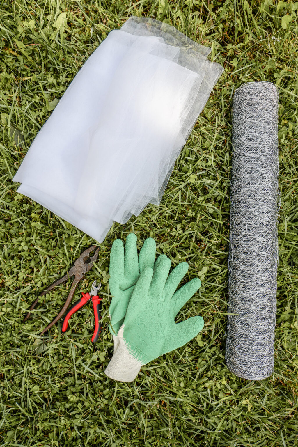 chicken-wire-with-pliers-and-safety-gloves-and-tulle-fabric