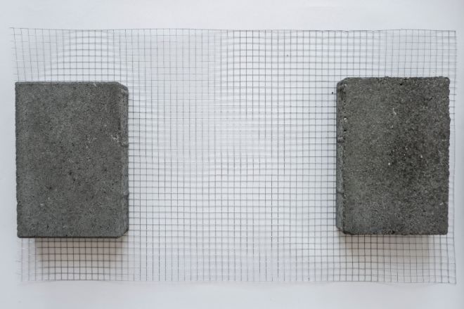 cut-length-of-wire-mesh-being-straightened-with-concrete-blocks