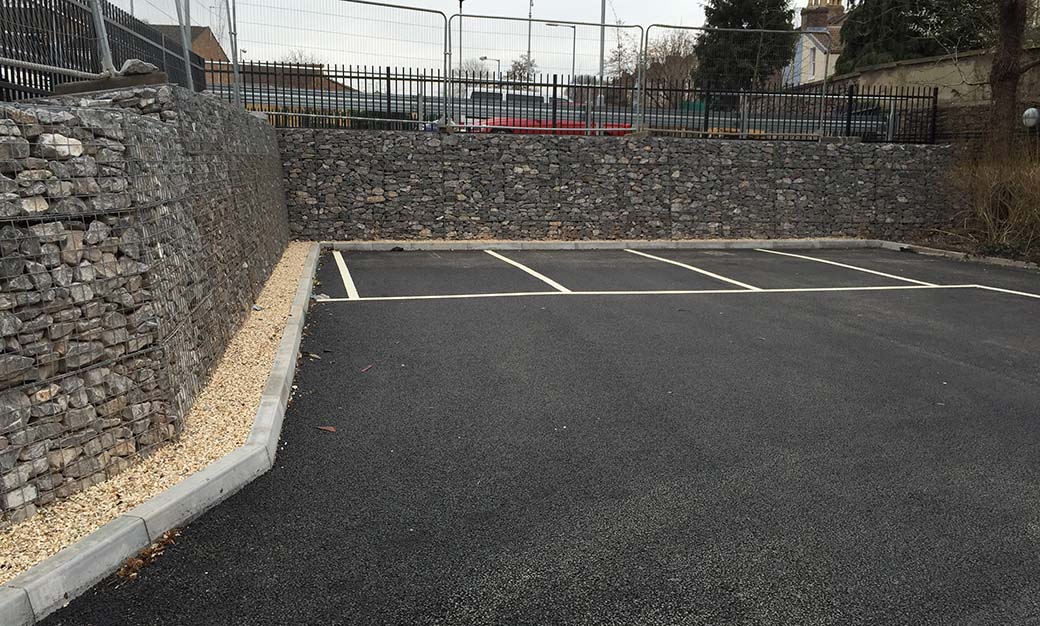2.45m engineer-designed gabion retaining wall built in line at Eastville Medical Centre, Bristol